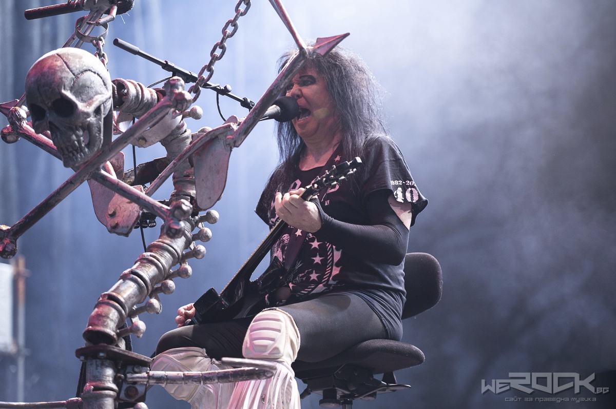 blackie lawless seated on stage